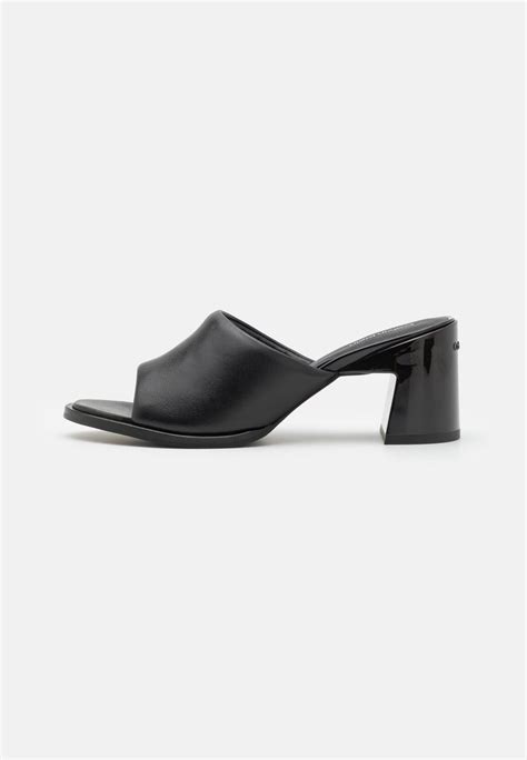 fake calvin klein sliders|calvin klein heeled mules black.